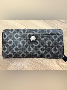 Coach Long Zip Around Wallet in the Horse and Carriage Dot Print.